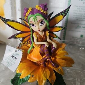 Whimsical Fairy Ceramic Figurine with Orange and Purple Accents